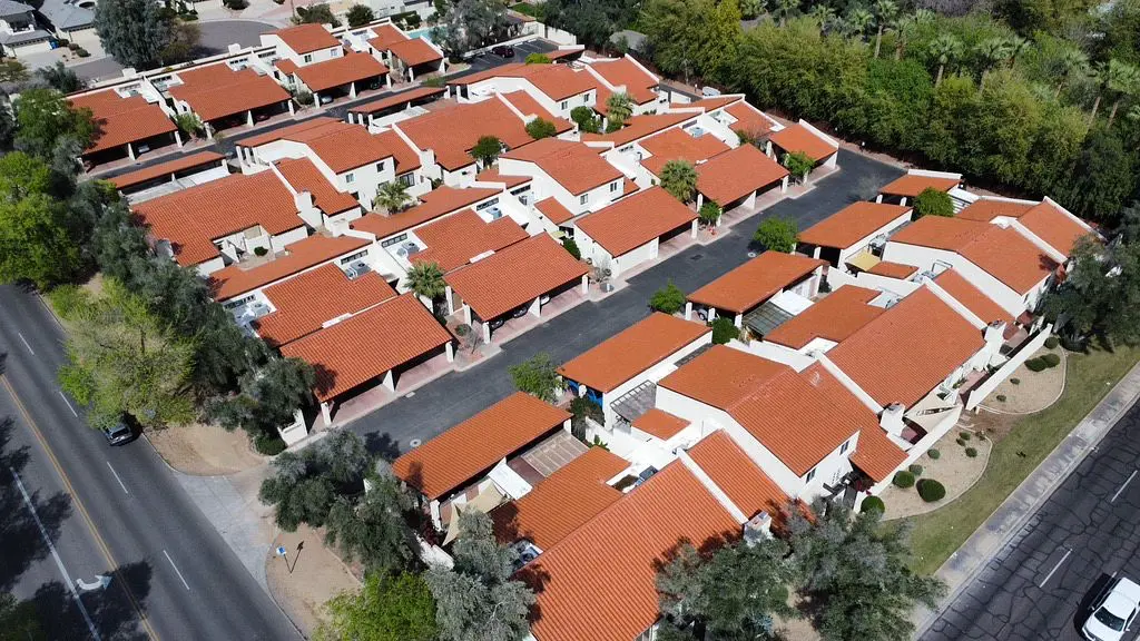 Drone view of residential neighborhood showing multi-family roofing in Phoenix